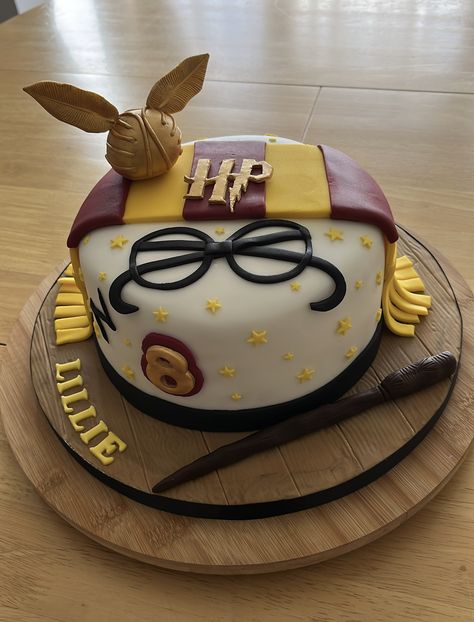 Harry Potter themed cake with the golden snitch,scarf and wand. All handmade . Easy Harry Potter Cake, Snitch Cupcakes, Harry Potter Cakes, Harry Potter Snitch, The Golden Snitch, Harry Potter Theme Birthday, Harry Potter Birthday Cake, Harry Potter Bday, Harry Potter Scarf