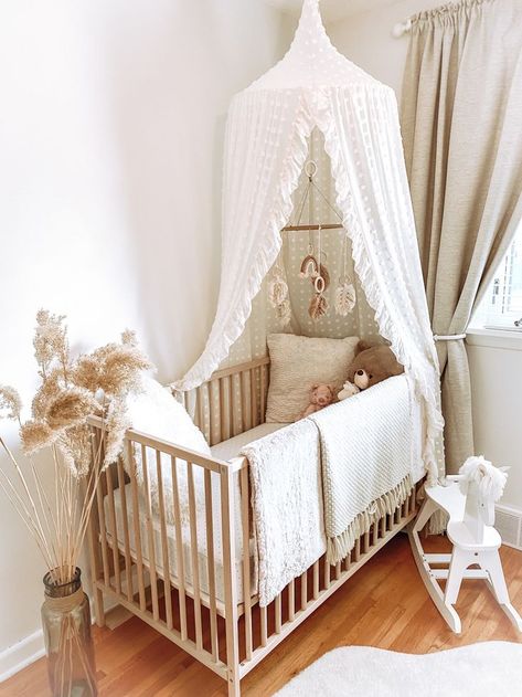 Whimsical boho nursery | Baby girl room decor, Baby crib canopy, Nursery baby room Nursery Crib Canopy, Canopy For Nursery, Canopy In Nursery, Nursery With Canopy Over Crib, Crib With Mobile, Canopy For Crib, Minimalist Neutral Nursery, Nursery With Canopy, Baby Room Inspiration Neutral