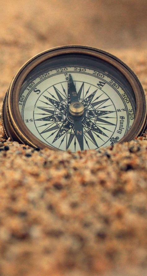 Compass in the sand iPhone wallpaper Compass Wallpaper, Wallpaper Travel, Map Wallpaper, A Compass, Travel Wallpaper, Pirate Life, Travel Maps, A Quote, The Sand