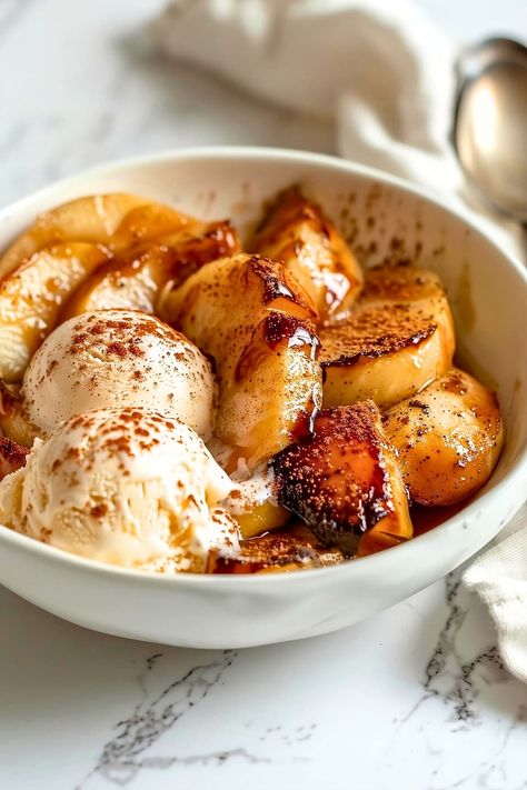 These baked apple slices are coated in warm cinnamon and sugar. Served with vanilla ice cream, they're an irresistible treat! Easy Cinnamon Cookies, Creamy Vanilla Ice Cream, Baked Apple Slices, Apple Cinnamon Recipes, Apple Ice Cream, Baked Apple Dessert, Fall Apple Recipes, Apple Cinnamon Muffins, Good Recipes