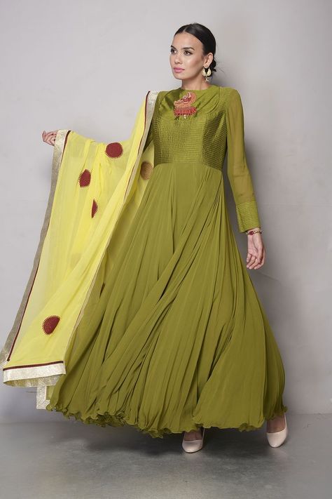 Olive Green Anarkali, where Chanderi meets Chiffon in perfect harmony. The Striped Chanderi Yoke, adorned with a Contrast Red Boota, steals the spotlight. The Circular Cut Chiffon Flare, layered with Can-can, adds a graceful swirl to your every step. Complete the look with a Yellow Georgette Dupatta featuring Red Threadwork Embroidered Motifs and a Silver Lampi Border #aascouture #couture #traditonal #ethnic #weddingwear #festive #anarkali Olive Green Anarkali, Chiffon Anarkali, Yellow Dupatta, Green Anarkali, Georgette Dupatta, Embroidered Motifs, Can Can, Perfect Harmony, Wedding Wear