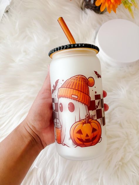 Halloween Cute Ghost Beer Can Glass | Retro Ghosts Can Glass | Pumpkin Spice Glass Cup | Fall Pumpkin Iced Coffee Cup| Checkered Glass Cup Perfect for all things Fall & pumpkin spice! It's a good day every time you use this cute glass cup! perfect for all your favorite iced coffee, smoothie and cold drink needs. details: ✧Designs are sublimated onto glass with sublimation ink. These are NOT made with vinyl, stickers, or     epoxy. ✧ 16oz  glass can. ✧The bamboo Rhinestone lid + glass straw add-on is the perfect aesthetic for on the go! care instructions: ✧ Hand wash only.  ✧ Do not soak ✧ Not dishwasher safe. ✧  Not microwave safe. Pumpkin Iced Coffee, Preppy Halloween, Halloween Cute Ghost, Perfect Aesthetic, Cute Coffee Cups, Coffee Smoothie, Boo Basket, Halloween Cups