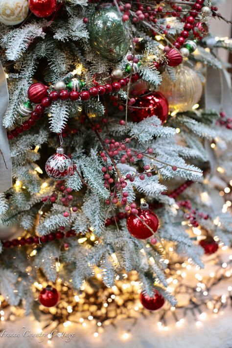 Red Tree Garland, Red Beads Christmas Tree, Red Bead Garland On Christmas Tree, Barn Christmas Tree, Barn Christmas, French Country Christmas, Frosted Christmas Tree, Frosted Tree, Snowy Christmas Tree