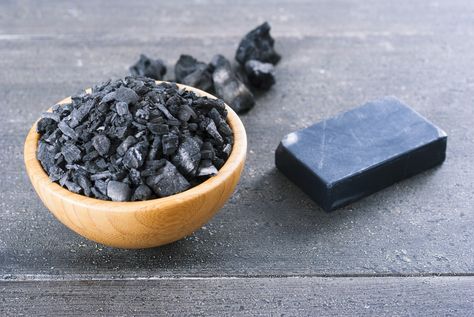 Activated charcoal, also known as activated carbon, is a powder made when common charcoal is heated in such a way as to develop lots of internal spaces or ‘pores’ which help to trap chemicals. This pure black powder – which is used in gas masks and water purifiers – is also sold in capsule form, and is a common additive in many skincare products. You… [read more] Activated Charcoal Uses, Charcoal Mask Benefits, Activated Charcoal Benefits, Raw African Black Soap, Charcoal Uses, Charcoal Soap, Coffee Staining, Activated Carbon, Activated Charcoal