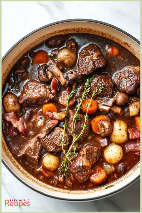 Beef Bourguignon, also known as Bœuf Bourguignon, is a classic French beef stew that’s slow-cooked in red wine with tender chunks of beef, smoky bacon, aromatic herbs, and hearty vegetables. This dish is famously rich and flavorful, making it perfect for a cozy family dinner or a special gathering. Best Beef Bourguignon Recipe, Easy International Recipes, French Beef Stew, Beef Chunks, Slow Beef Stew, Red Wine Beef, Beef Bourguignon Recipe, Homemade Italian Meatballs, Classic Beef Stew