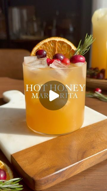 Nikki Sips 🤘🏻🍸 on Instagram: "Don’t forget about your tequila lovers as you prep for your holiday! This apple cider hot honey margarita is making me thankful for @mikeshothoney 🙌🏼. The perfect balance of spice & sweetness, you have to try it! Mike’s hot honey is available at Whole Foods, or my Amazon Storefront (link in bio 🫶🏼) _____ Hot Honey Margarita You’ll need: 3.5 oz apple cider 3/4 lime juice 1 oz Mike’s hot honey 1/2 oz orange liqueur 1.5 oz tequila Dried oranges wheel Few cranberries Sprig of rosemary Combine cider, honey, tequila, orange liqueur, and lime juice. Shake vigorously with ice. Strain into rocks glass with fresh ice, and garnish with cranberries, dried orange wheel, and a rosemary sprig. 🤗 #thanksgivingdrinks #mikeshothoney #margaritas #holidaymargarita #than Honey Margarita, Cranberries Dried, Holiday Margaritas, Cranberry Margarita, Orange Wheels, Orange Liqueur, Thanksgiving Drinks, Hot Honey, Rosemary Sprigs