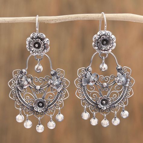 Reflecting the traditions of their country the Mazahua Family of Mexico designs this pair of chandelier earrings. Crafted of sterling silver each earring features floral and bird designs with elegant openwork. Sterling baubles dangle from the earrings. Silver Chandelier Earrings, Handmade Silver Jewellery, Bird Designs, Love And, Silver Chandelier, Sweet Earrings, Vintage Style Jewellery, Creating Jewelry, Children Clothes