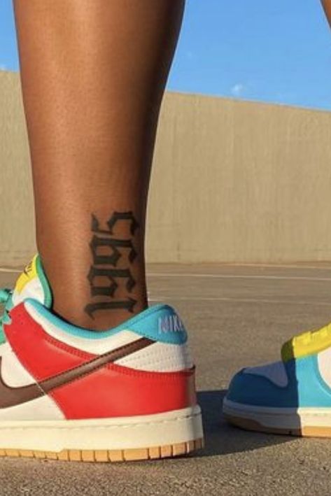 1999 Leg Tattoo, Back Of Calves Tattoo, Leg Tattoos Black Women Lower Calf, Women Leg Tattoos Calf, Calf Muscle Tattoo For Women, Lower Calf Tattoo Women, Calves Tattoos Women, Back Of Leg Tattoos Women Calves, Cartoon Tattoos Women