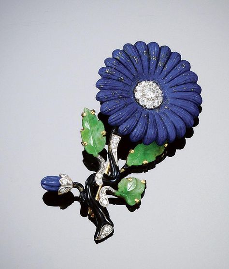 LAPIS LAZULI, JADEITE AND DIAMOND BROOCH, 1920s. Designed as a single flower head, with carved lapis lazuli petals encircling circular-cut diamond stamens, to a black enamel stem with carved jadeite leaves, lapis lazuli flower bud and circular- and single-cut diamond accents, rubbed maker's mark, accompanied by a case from Cartier, New York. Lapis Lazuli Jewelry, Diamond Brooch, Gold Brooches, Single Flower, Flower Bud, Fine Jewels, Vintage Jewels, Maker's Mark, Art Deco Jewelry