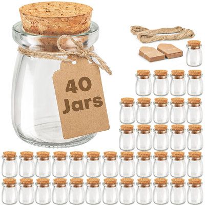 These little glass jars are perfect for DIY gifts for clients and families. glass jar has a contemporary design with a beautiful display, it stores conveniently, and looks great on any counter, party, or buffet table. Make your own vanilla extract, vanilla sugar, vanilla paste, and limoncello, and plan to use these jars for gifts. They have a choice between the plastic lids and the corks and also come with tags and twine. Item includes 40 pieces 3.4oz/100ml Glass Containers, each measuring 2.21" Jar Food Storage, Jar Food, Favour Jars, Glass Candy Jars, Small Glass Jars, Small Glass Bottles, Glass Bottles With Corks, Mini Glass Bottles, Vanilla Paste