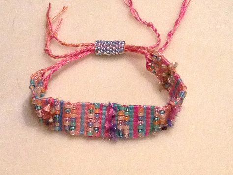 Finally finished!  I like the fuzzy yarn.  The bracelet looks "beachy" and fun to me. Yarn Bracelets, Fabric Bracelets, Fiber Jewelry, Dope Jewelry, Textile Jewelry, Woven Bracelets, Bracelet Crafts, Beads And Wire, Fabric Jewelry