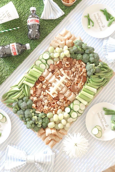 Looking for easy game day appetizers? Blogger Stephanie Ziajka uses green grapes, green veggies (broccoli, cucumbers, snap peas, and celery), Chex Mix, Totino's Pizza Rolls, and string cheese to create a fun game day snack board shaped like a football field in today's post! Click through for more Super Bowl grazing board ideas, plus a handful of other Super Bowl snacks and game day food inspo, on Diary of a Debutante! #gameday #snackboard #football #gamedaysnacks #superbowlsnacks #superbowlfood Football Crudite, Chex Mix Charcuterie Board, Football Field Charcuterie Board, Football Shaped Charcuterie Board, Game Day Snack Board, Football Charcuterie Board Ideas, Football Shaped Food, Football Charcuterie Board, Fccla Ideas