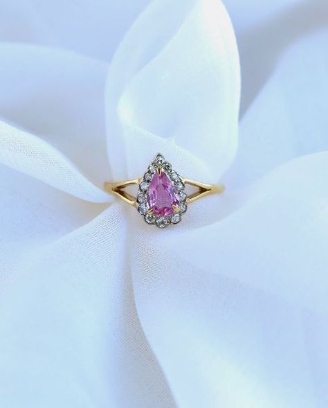 Trumpet & Horn - Vintage Jewelry 💍 on Instagram: "Step back in time with this breathtaking vintage pink sapphire and diamond ring, a true masterpiece from the 1980s. Its centerpiece is an exquisite pear shaped pink sapphire, weighing 0.58 carats, that radiates a captivating rosy hue. 💖 SKU: 27330" Jewelry Wishlist, Sapphire And Diamond Ring, Step Back, The 1980s, Back In Time, Pink Sapphire, Vintage Pink, Pear Shaped, In Time