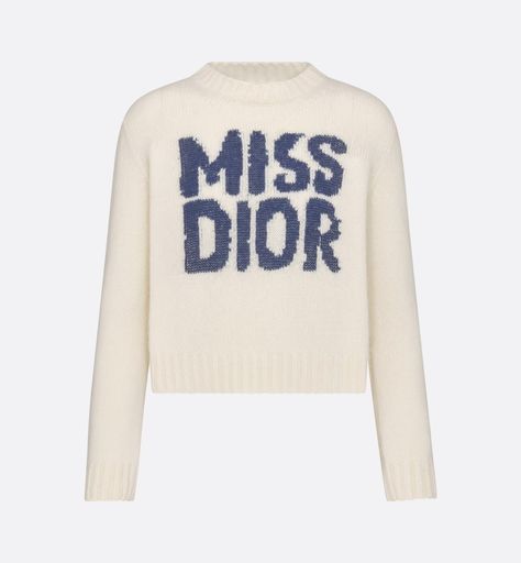 The sweater features the blue Miss Dior Graffiti motif, a nod to the 1967 debut ready-to-wear collection and a manifesto to Maria Grazia Chiuri's signature celebration of feminism. Crafted in an ecru cashmere and silk knit, it has a ribbed hem and cuffs. The round-neck sweater can be worn with casual outfits in any season and will pair well with other Miss Dior Graffiti creations. Dior Sweater, Denim Swimsuit, Stole Scarf, Maria Grazia Chiuri, Short Denim, Maria Grazia, Silk Knit, Miss Dior, Tshirt Skirt