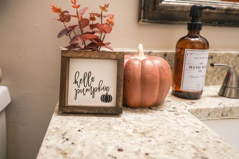 Rustic fall bathroom, fall decor, bathroom styling, bathroom decor Fall Bathroom Counter Decor, Simple Fall Bathroom Decor, Amber Soap Dispenser, Autumn Bathroom Decor, Autumn Bathroom, Hello Pumpkin Sign, Minimalist Fall Decor, Fall Bathroom Decor Ideas, Natural Fall Decor