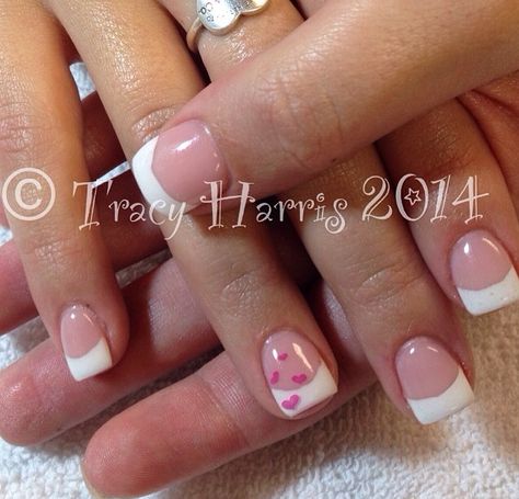 Simple heart nails White French Tip Nails With Heart On Ring Finger, French Manicure With Heart, French Nails With Heart Design, French Tip Nails With Hearts, French Nails With Heart On Ring Finger, French Tips With Small Heart, Pink French Tips With White Hearts, Black French Tips With Heart On Ring Finger, White Tip