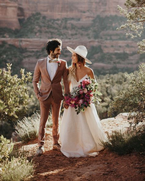 20 Unique Ways to Wear a Hat on Your Wedding Day #WeddingAccessories #WeddingHat #WeddingDetails #WeddingInspiration | Martha Stewart Weddings Bohemian Wedding Groom, Social Outfits, Wedding Suits For Bride, Outdoor Winter Wedding, Embellished Wedding Dress, Groom Wedding Attire, Red Bouquet Wedding, Winter Wedding Bouquet, Boda Mexicana