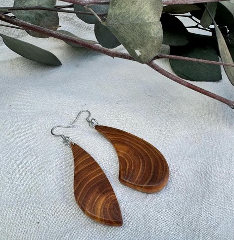 ✨ Handcrafted Elegance in Every Curve ✨ Discover the beauty of nature with our uniquely crafted wooden earrings, inspired by the organic flow of natural shapes. 🌿 Made from finely polished locally sourced Wild Elm, each piece showcases its own unique grain pattern. Paired perfectly with a soft, earthy aesthetic, these earrings add a touch of warmth to any outfit. 🌀 Complementing the wooden design, we’ve placed them alongside a beautifully textured shell, evoking the harmony between human ... Soft Earthy Aesthetic, Natural Essence, Earthy Aesthetic, The Beauty Of Nature, Wooden Design, Boulder Colorado, Eco Friendly Fashion, Wooden Earrings, Earth Friendly