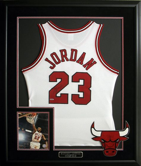 Michael Jordan autographed and framed jersey with photo and plate. #ChicagoBulls #Jordan #jerseys #Bulls #NBA Sport Jersey Display Ideas, Framed Basketball Jersey, Basketball Jersey Frame, Framing Jerseys Diy, Frame Jersey Ideas, Sports Jersey Display, Jersey Frame, Framed Memorabilia, Michael Jordan Autograph