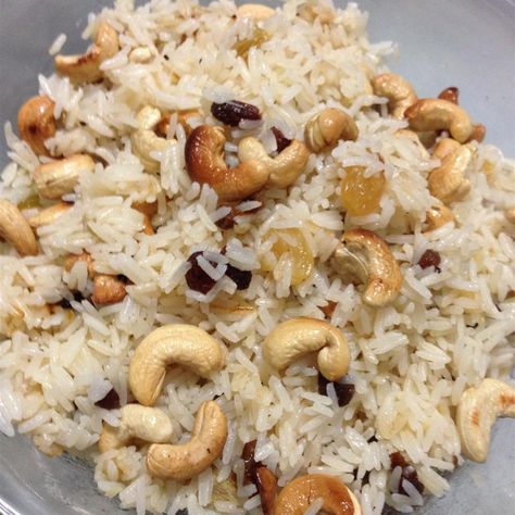 Rice with Almonds and Raisins Rice With Almonds, Flavored Rice Recipes, Raisins Recipe, Basmati Rice Recipes, Rice Side Dish Recipes, Raisin Recipes, Mexican Rice Recipes, Almond Chicken, Around The World Food