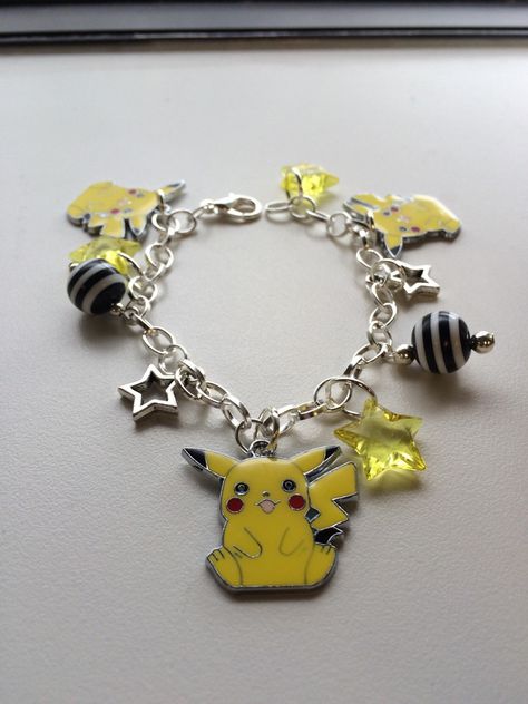 Pokemon Pikachu Inspired Silver Tone and Beaded Charm Bracelet by GeektasticCreations on Etsy https://www.etsy.com/listing/243822426/pokemon-pikachu-inspired-silver-tone-and Pokemon Bracelet, Stars Yellow, Pokemon Jewelry, Stars Bracelet, Pokemon Bead, Beaded Charm Bracelet, Pokemon Pikachu, Nerd Girl, Star Bracelet