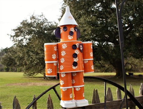 "THE TIN MEN ARE NOT A LICENSED PRODUCT! THE TAPE THEY ARE WRAPPED IN IS LICENSED, BUT THE TIN MEN ARE HANDMADE. Hand made Clemson Tigers Tin Man. He's 24\" tall and 12\" wide! Perfect gift for someone who has anything! They are painted, Pollyed, and taped for weather resistance! Can hang on your porch, in the yard, or in the house! We can custom make any NFL, College, MLB, Hockey, and high school team or any theme you desire! Just message or call/text me for custom order. Price is the same. Tha Tin Can Man, Traditional Wedding Gifts, Tin Can Crafts, Fourth Of July Decor, Tin Man, Clemson Tigers, School Team, Can Crafts, Themed Crafts