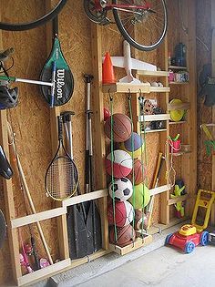 garage storage, cleaning tips, garages, shelving ideas, storage ideas, Nailing slats to the studs provided space to store oars fishing poles... Shed Organisation, Pontoon Ideas, Koti Diy, Basement Gym, Shed Organization, Storage Building, Garage Organize, Ball Storage, Basement Makeover