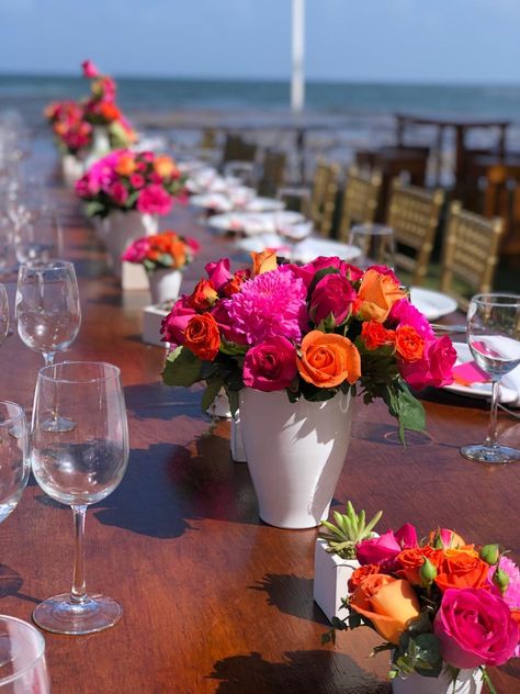 Hot Pink Orange Centerpieces, Hot Pink Mexican Party, Pink And Orange Floral Centerpieces, Pink And Orange Flower Centerpieces, Mexican Theme Flower Centerpieces, Bridal Shower Hot Pink And Orange, Cantarito Centerpiece Flowers, Hot Pink Floral Centerpieces, Pink And Orange Wedding Reception