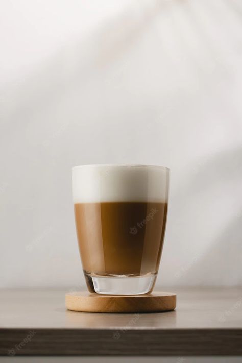 Premium Photo | Cappuccino in a glass cup on a wooden table coffee and froth milk Frothing Milk, 50 Million, Table Coffee, Wooden Table, Wooden Tables, Coffee Machine, Glass Cup, Premium Photo, Cappuccino