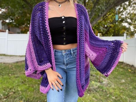 Stephanie 🦋 on Instagram: "shipping off this beauty today 💜🥺💕 i used yarn bee for this cardigan and it’s seriously so soft and easy to work with.. the colors are absolutely gorgeous too. so thankful for all the support ive received this holiday season 😘😭🥺💕💜💜• • • • #crochet #crochetersofinstagram #handmade #artist #hippie #boho #smallbusiness #shopsmall #christmas #gift" Hexagon Cardigan, Rave Jewelry, Cardigan Handmade, Yarn Bee, Bell Sleeve Sweater, Sweater Gift, Gemstone Jewelry Handmade, Bell Sleeve, Sleeve Sweater