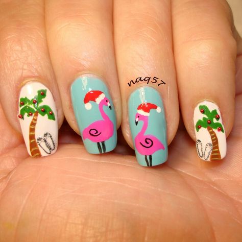 a tropical Christmas nail art                                                                                                                                                                                 More Tropical Christmas Nails Art Designs, Christmas Tropical Nails, Christmas In July Nail Designs, Beach Christmas Nail Art, Palms Nails Design, Christmas Flamingo Nails, Christmas Palm Tree Nails, Christmas In Hawaii Nails, Christmas Summer Nails