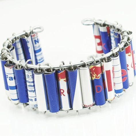 I made this cuff style bracelet from beads I made from recycled Red Bull cans. The aluminum beads are strung on galvanized steel wire. This bracelet is about 7 1/2" from end to end. The steel wire frame the bracelet is strung on is flexible enough to have enough give to fit a variety of wrist sizes, but strong enough to keep its shape. This item is made to order, and may vary slightly from the one pictured.Please check out the rest of my shop to see my entire selection of guitar string, steampun Denim Cuff Bracelet, Denim Bracelet, Denim Earrings, Found Object Jewelry, Aluminum Can Crafts, Paper Bead Jewelry, Fabric Bracelets, Map Pendant, Denim Jewelry