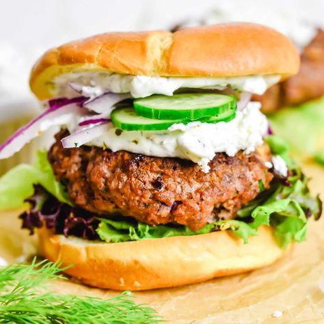 Mediterranean-style beef Greek burgers feta cheese & creamy tzatziki sauce. Ready in under 30 minutes & perfect for burger night! Greek Burgers, Harris Teeter, Lamb Burgers, Burger Night, Grilled Lamb, Tzatziki Sauce, Pesto Recipe, Feta Cheese, Pesto