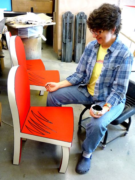 Dr. Seuss' The Cat in the Hat is coming to CTC, and because of it's story book nature the props team here at CTC has been busy, busy, busy.  Here Katie Albright is painting some of the fun furniture pieces we will be using in the show. Photo by Mary Zimmerman. Dr Seuss House, Cartoon Furniture, Theatre Ideas, Book Nature, Children's Theatre, Seuss Classroom, Seuss Party, The Cat In The Hat, Kids Theater