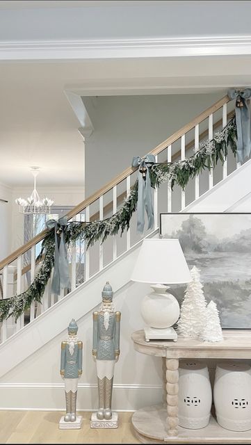 ℒ𝒶𝒸ℯ𝓎| 🌿Home Decor on Instagram: "It wouldn’t be Nov 2nd around here without some Christmas decor! When do you guys decorate for the holidays? . #christmas #christmasdecor #christmasgarland #garland #stairgarland #garlandideas #christmasdecorations #christmasideas #nutcrackers #coastalchristmas #neutralchristmasdecor #neutralchristmas #grandmillenial #bluechristmas #holidaydecor #holidayseason #holidaydecorideas #decorideas #homedecor #christmastime #garlands #afloral #norfolkpinegarland #no Blue Nutcracker Christmas, Baby Blue Christmas Decor, Blue Nutcracker, Christmas Hallway, Light Blue Decor, Christmas Interior Decor, Blue Christmas Decor, Neutral Christmas Decor, Christmas Interiors