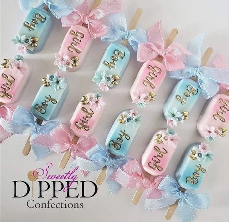 Cakesicles Gender Reveal, Gender Reveal Petit Fours, Gender Reveal Cakesicles, Gender Reveal Oreos, Chocolate Covered Pretzel Rods Gender Reveal, Gender Revel Cake, Pink And Blue Treats Gender Reveal, Pink And Blue Cookies Gender Reveal, Cake Sickles