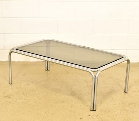 Large chrome steel tubular coffee table with smoked glass, 1970s Glass Salon Table, Glass Chrome Coffee Table, Glass And Chrome Coffee Table, Chrome Glass Coffee Table, Stainless Table Design, 60s Coffee Table, Glass Coffee Table Diy, 70s Coffee Table, Bauhaus Coffee Table