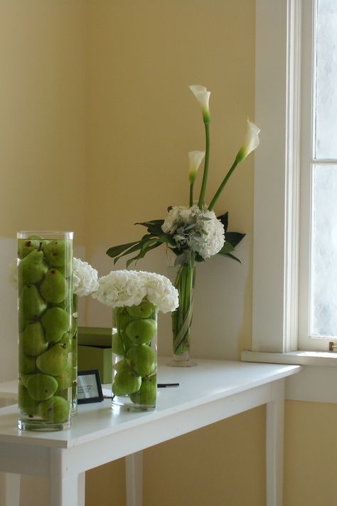 Apples and green pears in vases for centerpieces or accents Apple Wedding Centerpieces, Sage Ideas, Conference Decor, Hedge Apples, Apple Centerpieces, Vases For Centerpieces, Apple Wedding, Green Centerpieces, Teachers Lounge