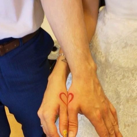 Couple each with half of a heart tattoo on their thumb area Half Heart Tattoo, Couple Tattoo Heart, A Heart Tattoo, Hand Heart Tattoo, Tattoo On Finger, Married Couple Tattoos, Marriage Tattoos, Heart Tattoo On Finger, Finger Tattoos For Couples