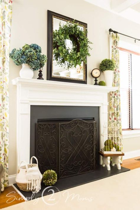 Whether you prefer farmhouse or transitional, colorful decor or neutral, we've got some easy ways to style your fireplace mantel for summer! Learn how to decorate your fireplace mantle and hearth using new and vintage decor. We love using real and faux greenery, and real and faux florals too. These ideas work for any traditional, transitional, and modern farmhouse home. You'll love both the stacked stone gas fireplace and the painted marble fireplace shown in the examples. Fireplace Hearth Ideas Decor, Summer Fireplace Decor, Fireplace Decorating Ideas, Traditional Fireplace Mantel, Christmas Trees White, Fireplace Decorating, Metallic Ornaments, Farmhouse Mantle Decor, Geometric Christmas