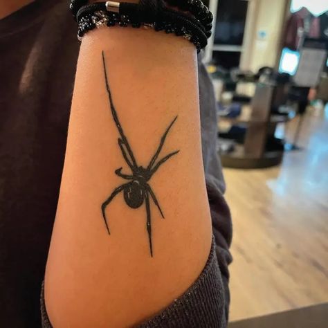 Simple Black Widow Spider Small Insect Blackwork Tattoo Idea & Design on Women Forearm Simple Black Widow Spider Tattoo Done At Simple Black Widow Tattoo, Black Widow Neck Tattoo, Black Widow And Web Tattoo, Black Widow Spider Tattoo Design, Female Black Widow Spider Tattoo, Black Widow Spider Tattoo, Black Widow Tattoo, Widow Spider, Black Widow Spider