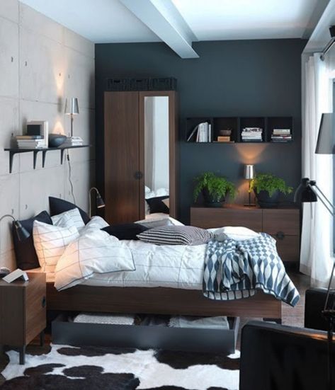 This small, masculine bedroom uses strategic organization to make every inch of square footage count! This is also a great example that dark wall colors don't always make a small space feel smaller. Ikea Small Bedroom, Ikea Bedroom Design, Små Rum Lidt Plads, Small Bedroom Interior, Small Space Bedroom, Bedroom Small, Small Bedroom Designs, Small Bedroom Decor, Bilik Tidur