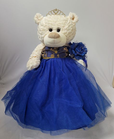 PRICES MAY VARY. 20" Quinceanera Teddy Bear with dress Can be given as a gift or used as a centerpiece 20 inches in height. Matching color wrist bouquet ,rhinestone tiara and an embroidered " Mis 15 Anos" For Collection and Decoration Purpose. For Age 14+. Due to different monitors/calibrations colors may vary slightly from the actual product. For those that are looking for something other than a doll... we now have the option of Quince Bears. These bears measure 20" long. Crème color, soft and Quinceanera Last Doll, Quince Bears, Quinceanera Teddy Bear, Dress Centerpiece, Crème Color, Quince Stuff, Doll Teddy Bear, Sweet 15 Party Ideas, Quinceanera Centerpieces