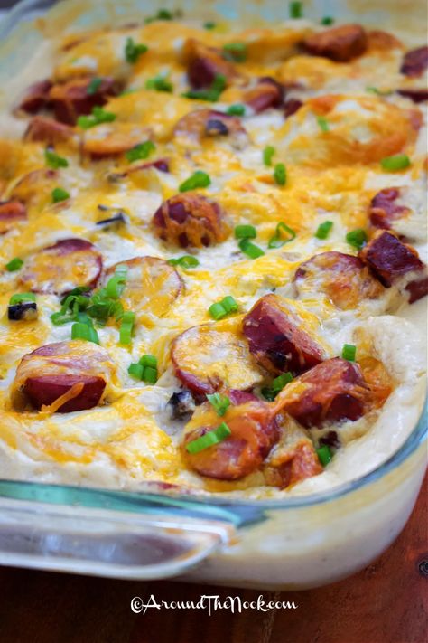 This baked Pierogi Casserole recipe uses store bought ingredients like frozen pierogies, canned soup and sausage so it can be tossed together in no time. And using just one casserole dish means even quicker clean up. Modify the recipe and add sauteed mushrooms or red peppers. Or reduce the milk and add sour cream or greek yogurt for a richer sauce. There are so many options with this easy recipe. #pierogiecasserolerecipe #easypierogicasserole #bakedpierogi #aroundthenook Sausage And Pierogies Bake, Pierogies And Kielbasa, Frozen Pierogies, Pierogi Casserole, Perogies Recipe, Mushroom Casserole, Canned Soup, Sausage Bake, One Dish Dinners