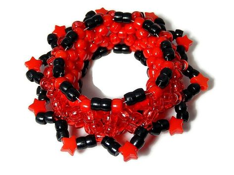 This red 3D kandi cuff consists of kandi beads in different shades of red with black kandi stars. It is made with stretch cord. Stretches comfortably to fit a 6.5in-9in. wrist. More kandi cuffs for sale here: http://www.etsy.com/shop/Allysin/search?search_query=kandi&search_submit=&search_type=user_shop_ttt_id_5262806&shopname=Allysin Have a look at my other shop: Unique gemstone jewelry: http://jewelicide.etsy.com 3d Kandi Cuff, 3d Kandi, Kandi Beads, Kandi Necklace, Diy Kandi Bracelets, Kandi Cuffs, Diy Kandi, Kandi Kid, Heart Sprinkles