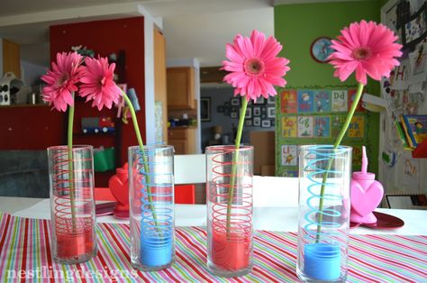 Colorful #Slinky used to add color in floral centerpieces Slinky Centerpiece, Valentine's Party, Mom Party, Spring Into Action, 80s Party, Toy Story Party, Valentines Party, Floral Centerpieces, Party Event