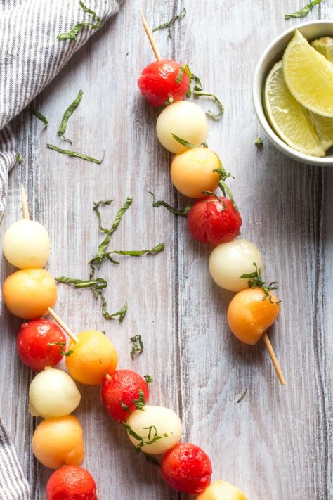 Melon balls dunked in lime, honey and ginger, and then slid onto skewers. A final flourish of mint finishes them off. Melon Ball Skewers, Cantaloupe Balls, Fruit Kabob, Melon Balls, Pizza Fruit, Roasted Cabbage Steaks, Fruity Recipes, Cabbage Steaks, Skewer Appetizers