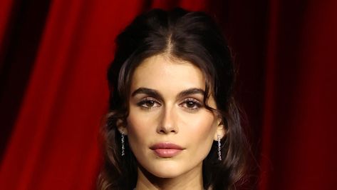 Kaia Gerber put on an elegant display while making an appearance at the glitzy 2024 Academy Museum Gala in Los Angeles on Saturday. Kia Gerber, Academy Museum Gala, Flowy Gown, Light Curls, Academy Museum, Alexander Mcqueen Dresses, Laura Dern, Carol Burnett, Half Updo