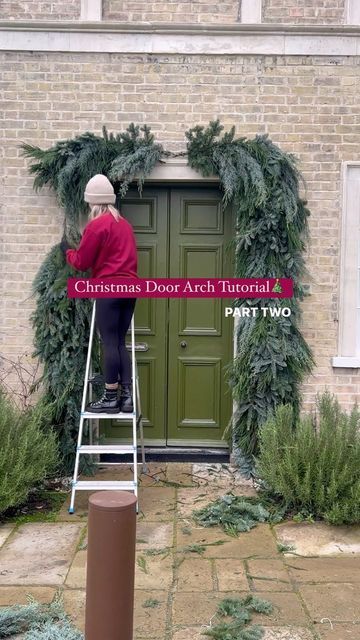 32K views · 1.2K likes | ALEX | DIY, Upcycling & Lifestyle on Instagram: "CHRISTMAS DOOR ARCH TUTORIAL PART TWO 🎄 The foliage is added & she’s turning into a beauty! Im still trying to decide whether to add a red bow at the top or not - what do you think? Don’t forget to check back tomorrow for the full reveal! 😍 #doorarch #christmasdoor #christmasarch #diychristmas #christmasdecor #christmasdoorarch #christmaswreath" Christmas Arched Front Door, Outside Arch Christmas Decor, Over Door Christmas Decorations, Christmas Arch Diy Outdoor, Arched Window Christmas Decor, Door Arch Christmas Decor, Holiday Archway Decor Outdoor, Christmas Door Arch Diy, Diy Door Arch