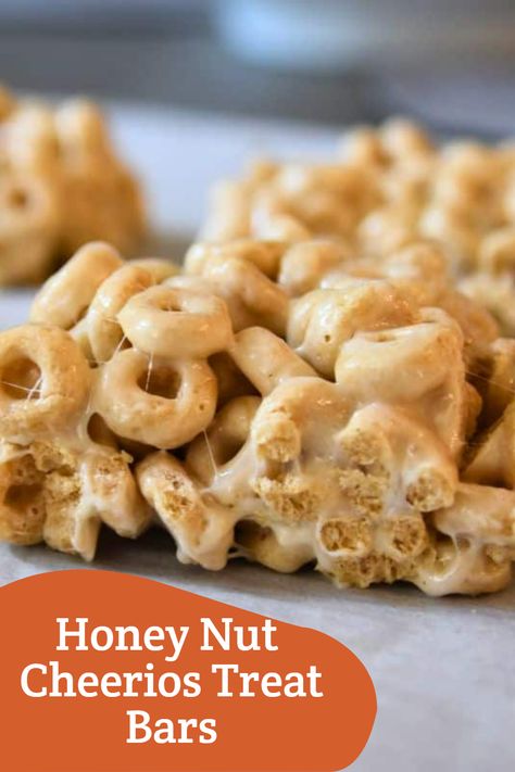 Turn your Honey Nut Cheerios into a tasty treat! These Honey Nut Cheerios Treat Bars are quick, easy, and the perfect combination of nutty and sweet. You won't be able to stop at just one. Honey Nut Cheerios Cereal Bars, No Bake Cheerio Bars Easy Recipes, Honey Nut Cheerios Bars, Honey Nut Cheerios Marshmallow Treats, Rice Krispie Treats With Cheerios, Snacks Made With Cheerios, Recipes Using Honey Nut Cheerios, Fried Cheerios Recipes, Honey Nut Cheerios Snack Mix Recipes